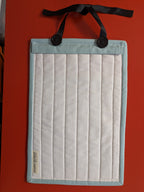 Fabric pouch with buttons on a red background
